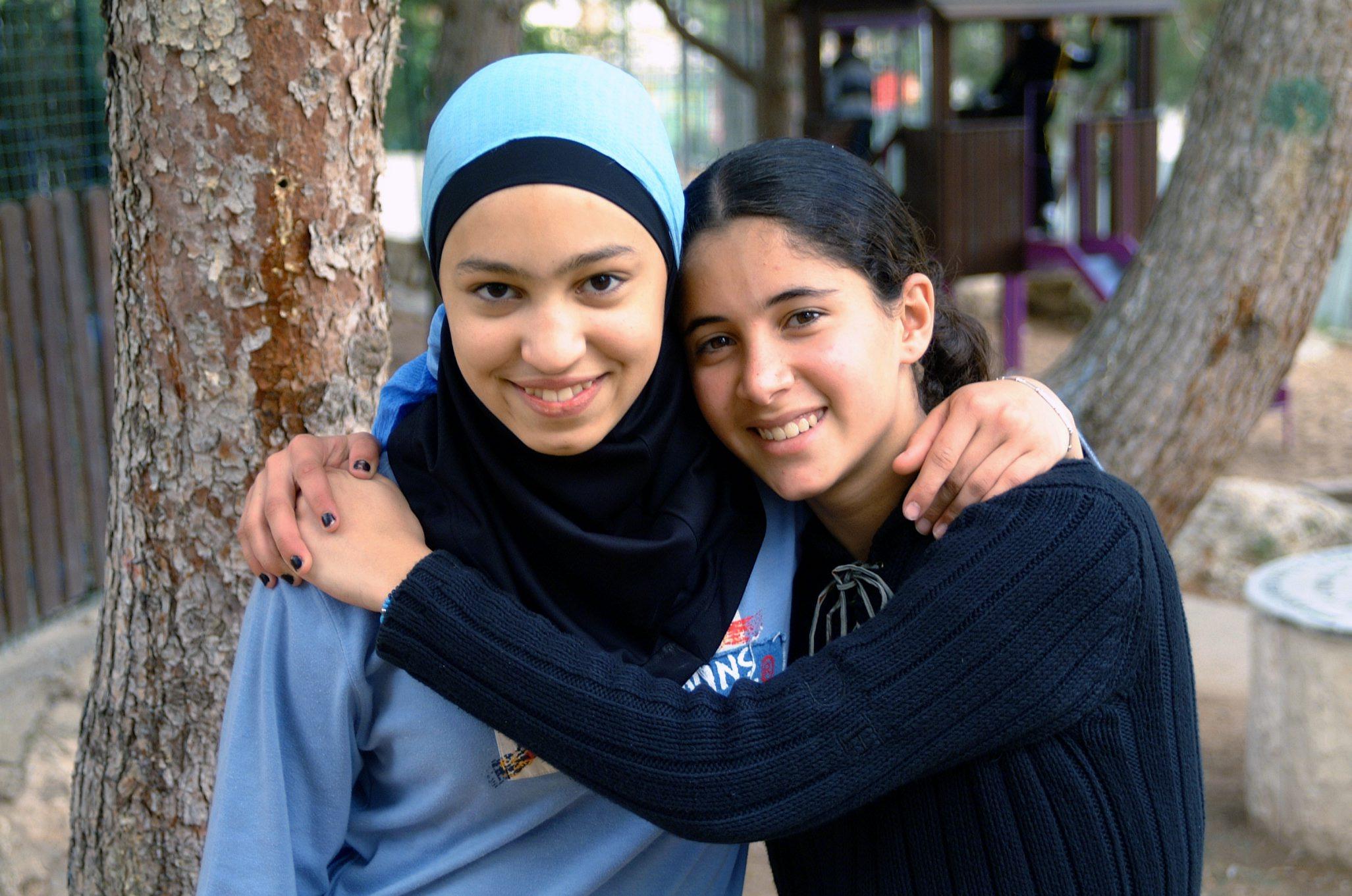 A Jewish girl and an Arab girl together. Illustrative.