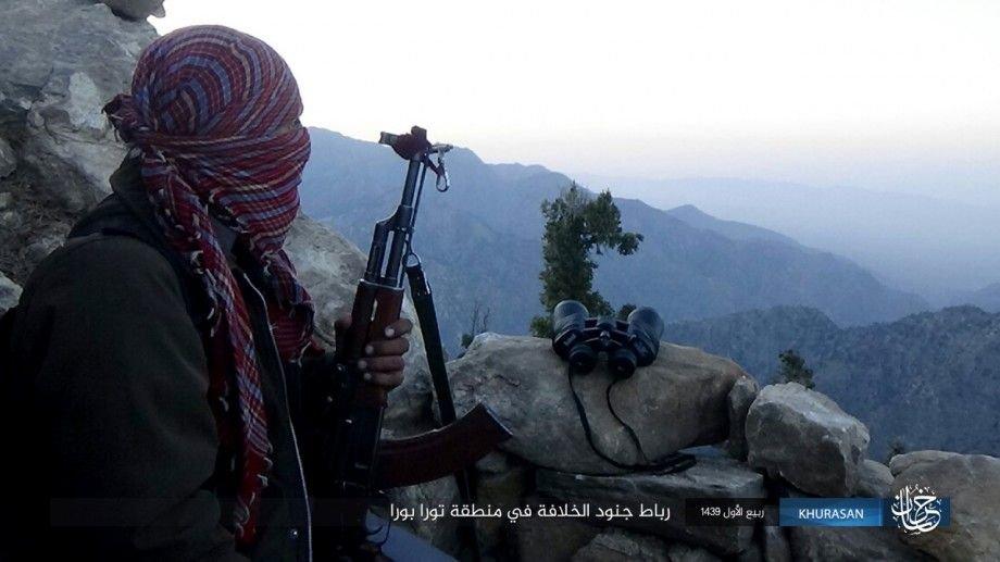 An IS fighter on guard duty (ribat) from IS' 'Khorasan Province' overlooking the mountains of the Tora Bora area. An IS fighter on guard duty (ribat) from IS' 'Khorasan Province' overlooking the mountains of the Tora Bora area.