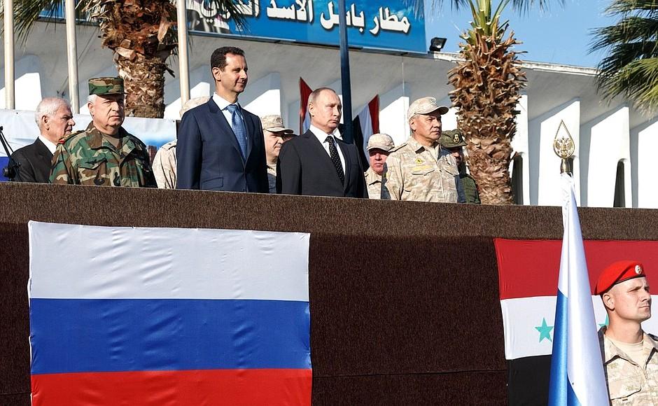 Vladimir Putin and Bashar al-Asad at the Khmeimim air base in Syria.